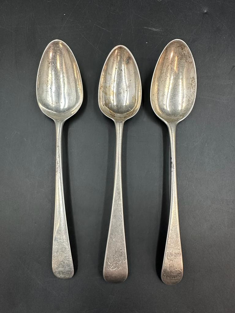 Three silver spoons, one dated London 1744, indistinct hallmarks on the others, approximate total