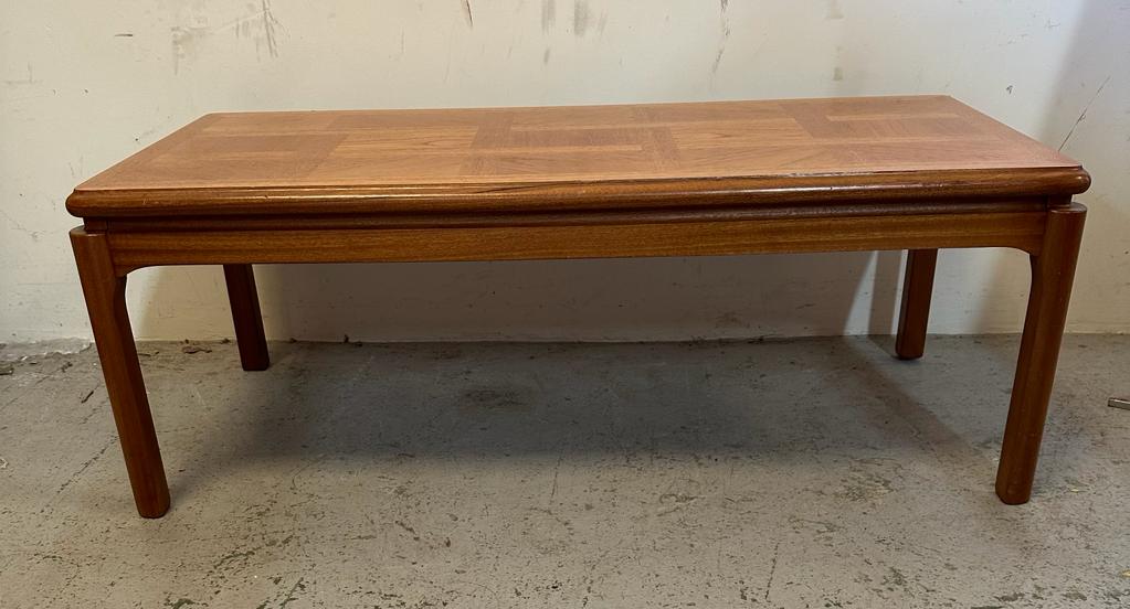 A Mid Century teak coffee table by Nathan (H43cm W110cm D52cm)