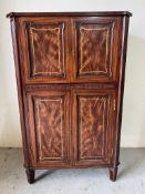 A Theodore Alexander drinks cabinet, panelled front raising top opening to mirror back and marble