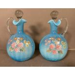 Two Victorian milk blue hand blown and hand painted glass decanters with floral detail