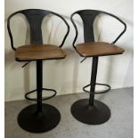 A pair of contemporary industrial style bar stools