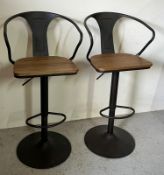 A pair of contemporary industrial style bar stools