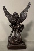 A bronze statue of St Michael The Arc angel Trampling a demon signed Erte (H27.5cm)