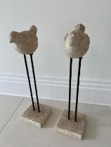 Two statues of faux stone birds