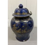 An Oriental lidded jar in blue with metal catch Height 60cm