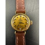 A Ladies 18ct gold Omega De Ville wristwatch, circular gold coloured dial, yellow faceted dot hourly