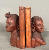 A pair of hand carved African tribal style book ends