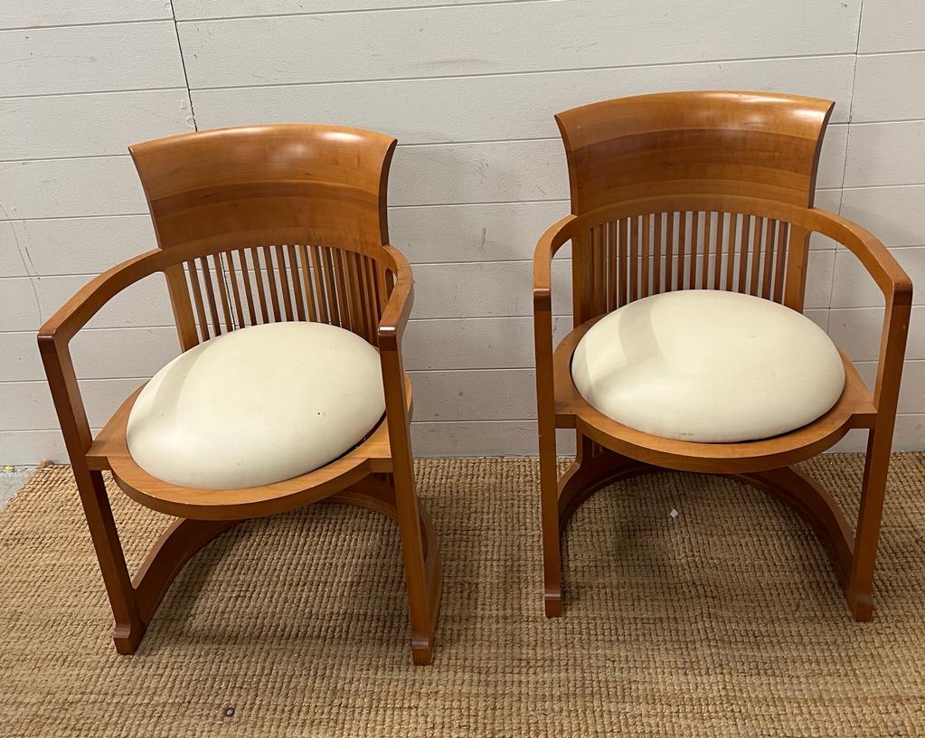 A pair of Frank Lloyd Wright (1867 - 1959) for Cassina barrel chair