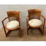 A pair of Frank Lloyd Wright (1867 - 1959) for Cassina barrel chair