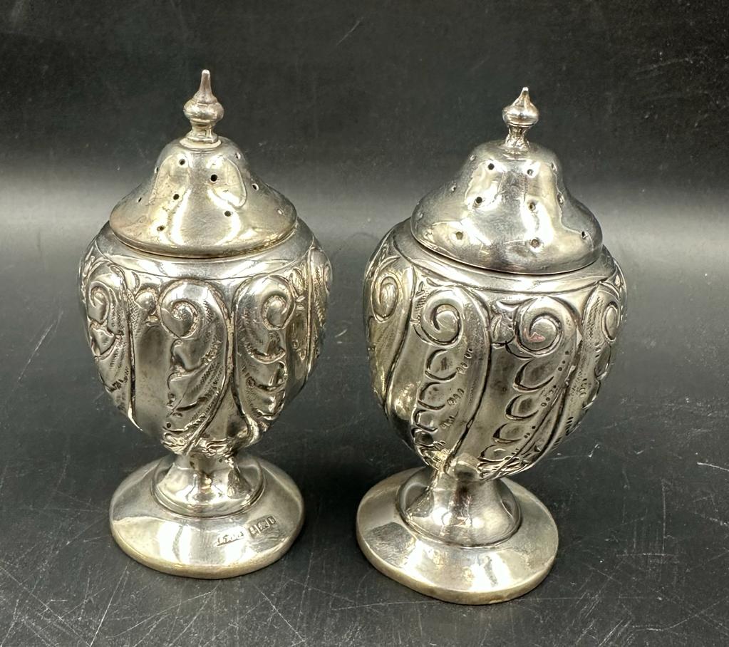 A pair of silver peppertrees hallmarked for Birmingham (Total weight 57g)