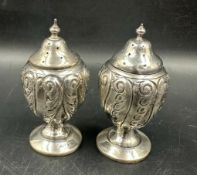 A pair of silver peppertrees hallmarked for Birmingham (Total weight 57g)