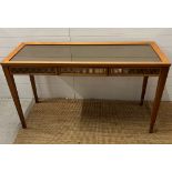 Linley a glass topped console table with tapering legs and centre drawer (140cm W x 50cm D x 80cm
