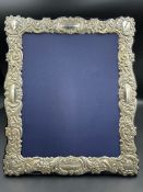 A Carrs of Sheffield Ltd silver ornate picture frame on an easel back. Hallmarked for Sheffield 2015