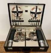 A cased picnic set with flasks and china etc