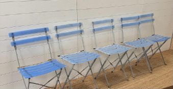 A selection of five blue slat back folding garden chairs.