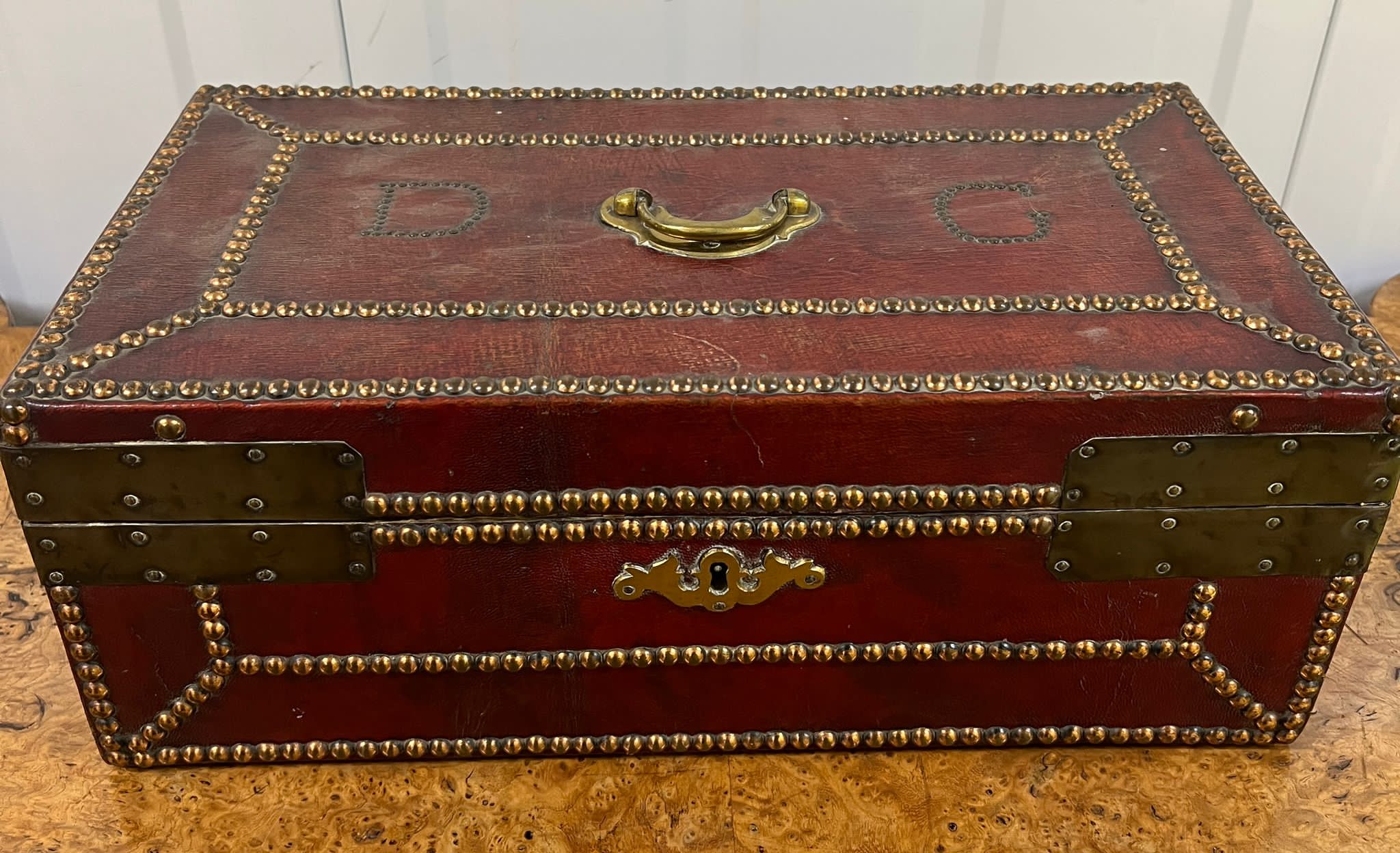 A red leather and brass deed box with stud detail (40cm x 23cm x 15cm) Dated to c 1750 Daniel