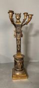 A single Empire bronze, four light candleabra on stepped base, rams heads,