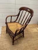 A Victorian oak his and hers stick back chairs with cane seat s