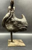 A signed bronze of a Rhinoceros head on stand. H22cm W15cm D10cm