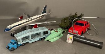 A selection of play worn Diecast vintage toys to include A BOAC aeroplane, a submarine and a Dinky