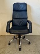 A blue leather adjustable office chair on castors