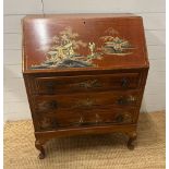 A three drawer bureau with a Chinese pastoral scene decoration