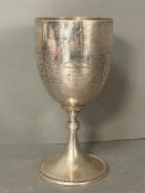 An Indian silver cup (Approximate Height 25cm) Engraved Calcutta 16th August 1881 The Monsoon