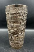 An Indian silver beaker with blank shield cartouche and village scene decoration. (H 16.5cm