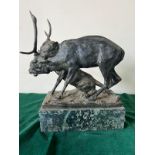 A bronze sculpture of a panther seizing a stag on a marble based, signed (H32cm W30cm)