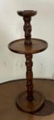 An oak turned floor standing ashtray,(H70cm Dia27cm)