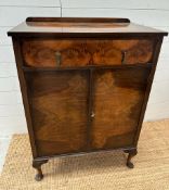 A Flame Mahogany cabinet with single drawer over, on cabriole legs ( 105cm x 45cm x 75cm)