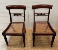 A pair of William IV hall chair