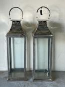A pair of floor standing lanterns (119cm)