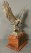 Great American Race LA to New York 1985 25th Place Trophy, a cast brass eagle on top of a wooden