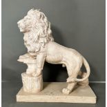 A sculpture of a stately lion resting on an anvil (H49cm)