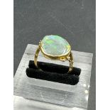 An 18ct gold and opal ring, approximate total weight 6.7g Size N