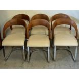 A set of six Girado chairs in walnut, chrome with leather seat pads.