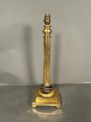 A brass empire column table lamp
