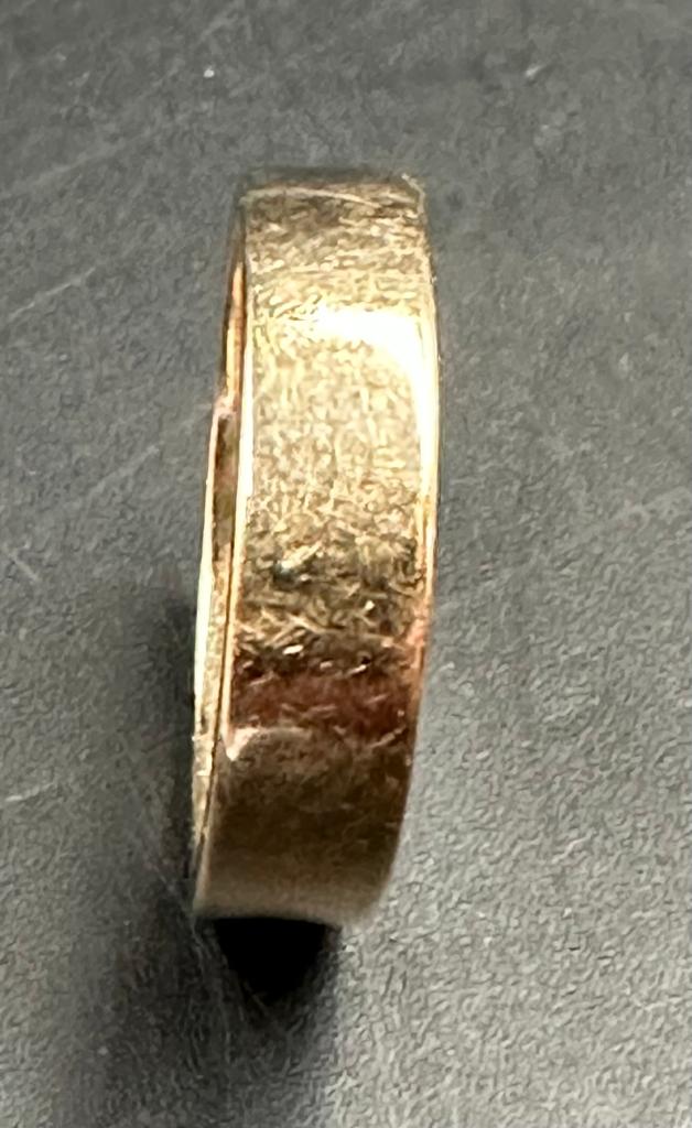 A yellow gold wedding band