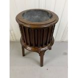 A George III style mahogany drum-shaped Jardiniere/ wine cooler, fluted sides moulded square on four
