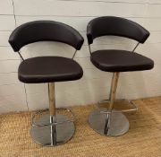 A pair of Calligans New York adjustable bar stools on chrome bases
