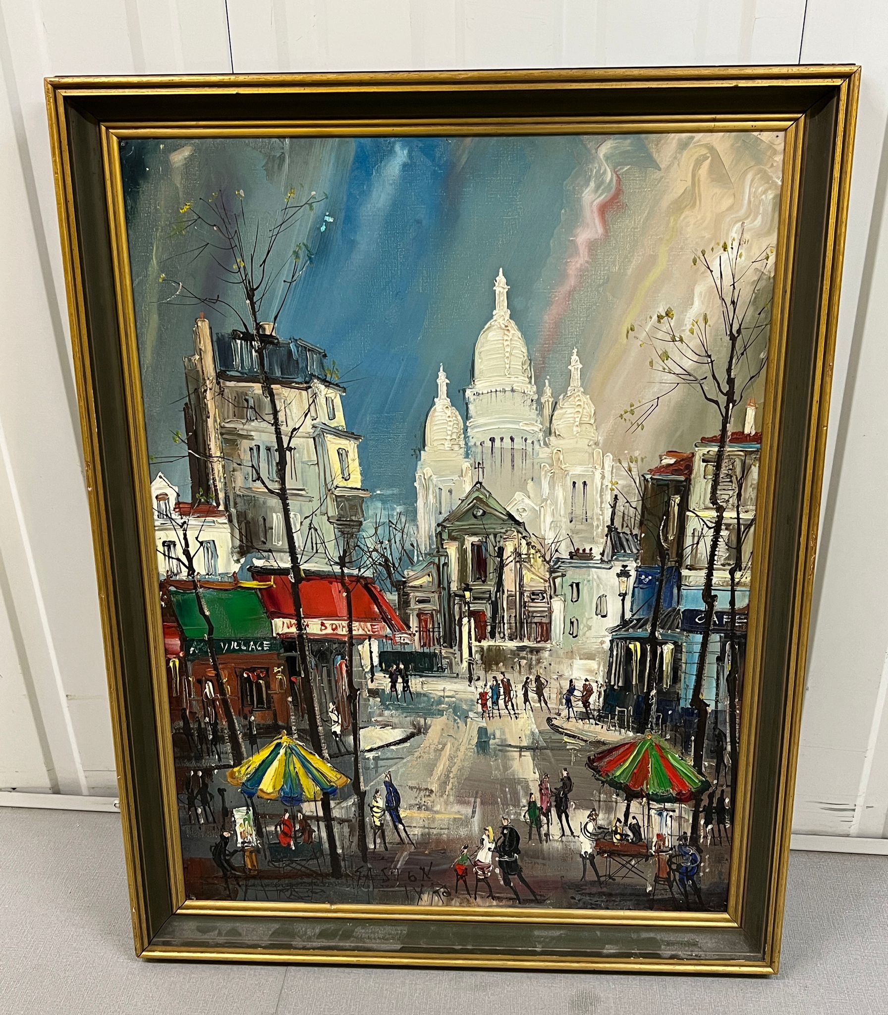 A Parisian street scene, oil on canvas with indistinct signature bottom right.