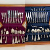 Two canteens of cutlery in wooden boxes.