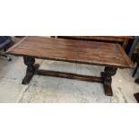 An Elizabethan jointed oak refectory table with three plank top on baluster legs and stretchers (