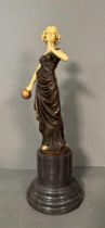 An Art Deco style bronze and resin figure of a lady on a marble plinth (H43cm)