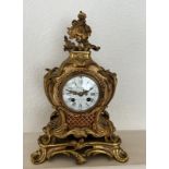 An ornate French mantle clock, eight day by Costain Galerie de la Madeleine Paris.