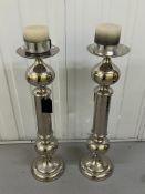 Two chrome contemporary candlesticks Height 72cm.