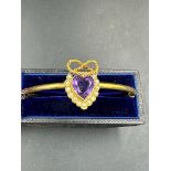 A Vintage 9ct gold bracelet with amethyst style stone i heart shaped surrounded by seed pearls (