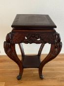 A Chinese hardwood lamp table on ornate curved legs (43cm sq x 75cm H)