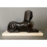 A Bronze cast of a Sphynx with typical head-dress on a marble base (29cm x 12cm base)